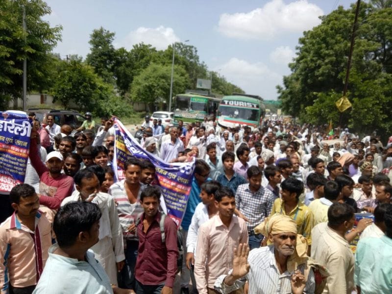 Procession of villagers to collectrate
