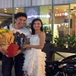 girl proposes to boyfriend with a Harley motorcycle and property deed