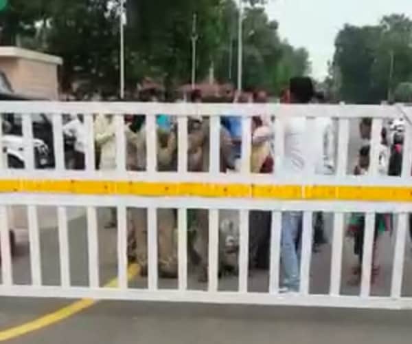 Police beats a woman in front of Chief minister's house.