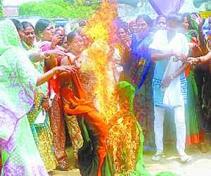 Protest with burn saari given by government
