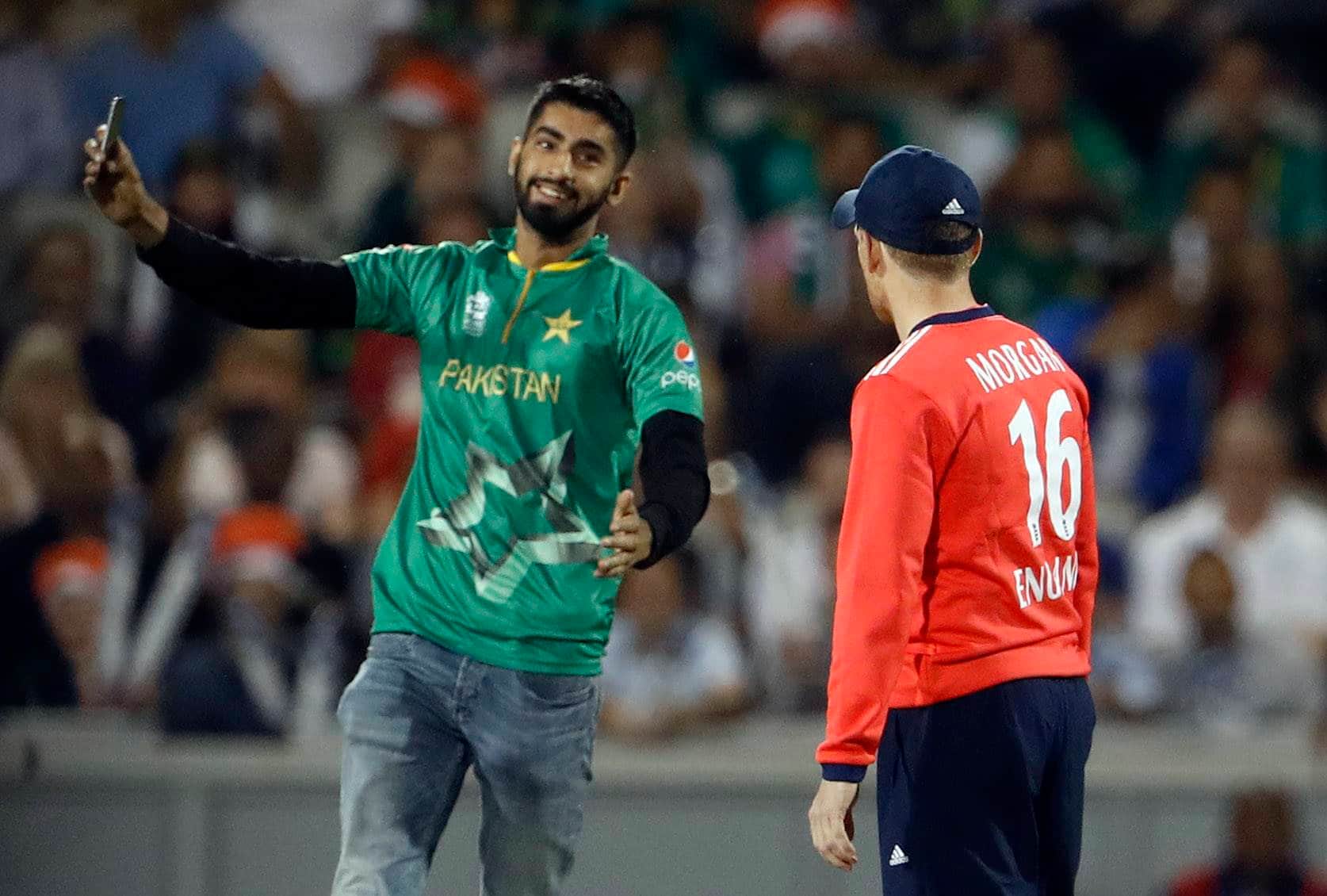 A Pakistan fan invades the pitch during t20 match
