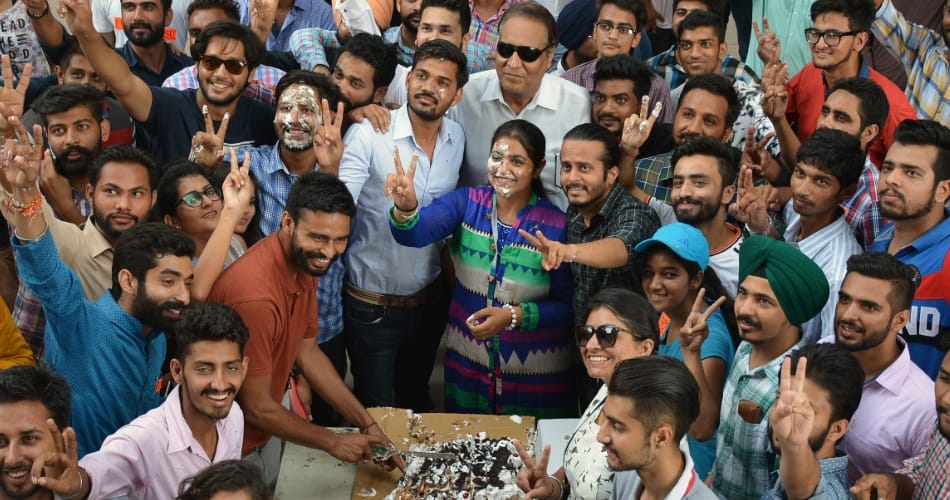 PUSU students cut the cake at Student center punjab university