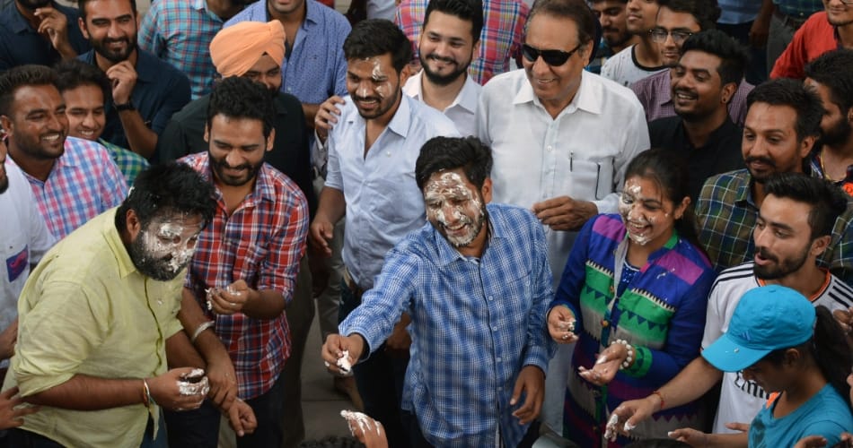 PUSU students cut the cake at Student center punjab university