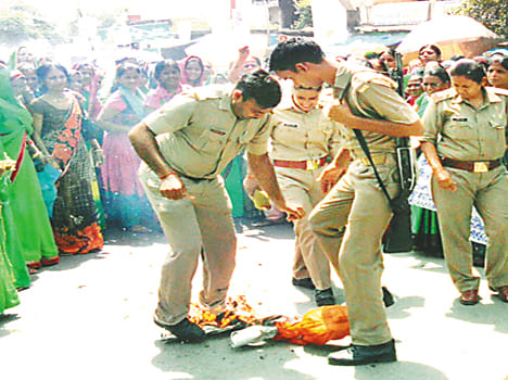 Burned effigies of the director workers