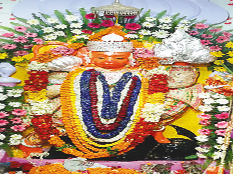 Gunje cheers from the large temple on Tue