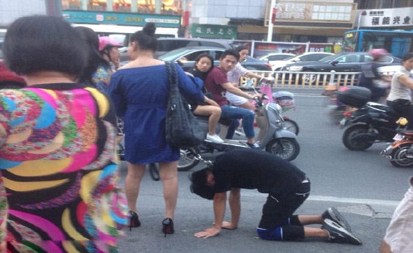 woman takes her boyfriend for a walk on a DOG LEASH 