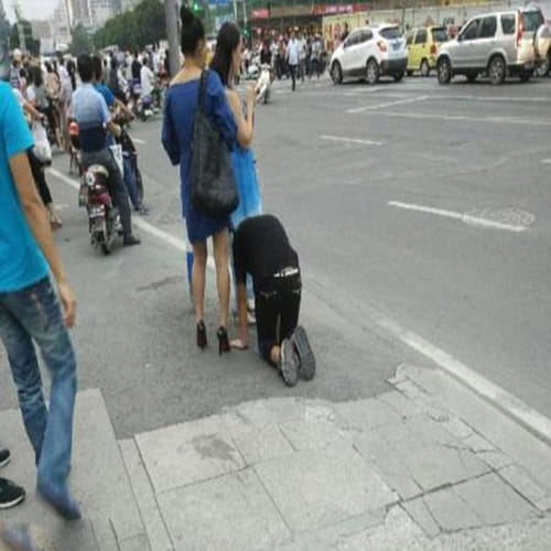 woman takes her boyfriend for a walk on a DOG LEASH 