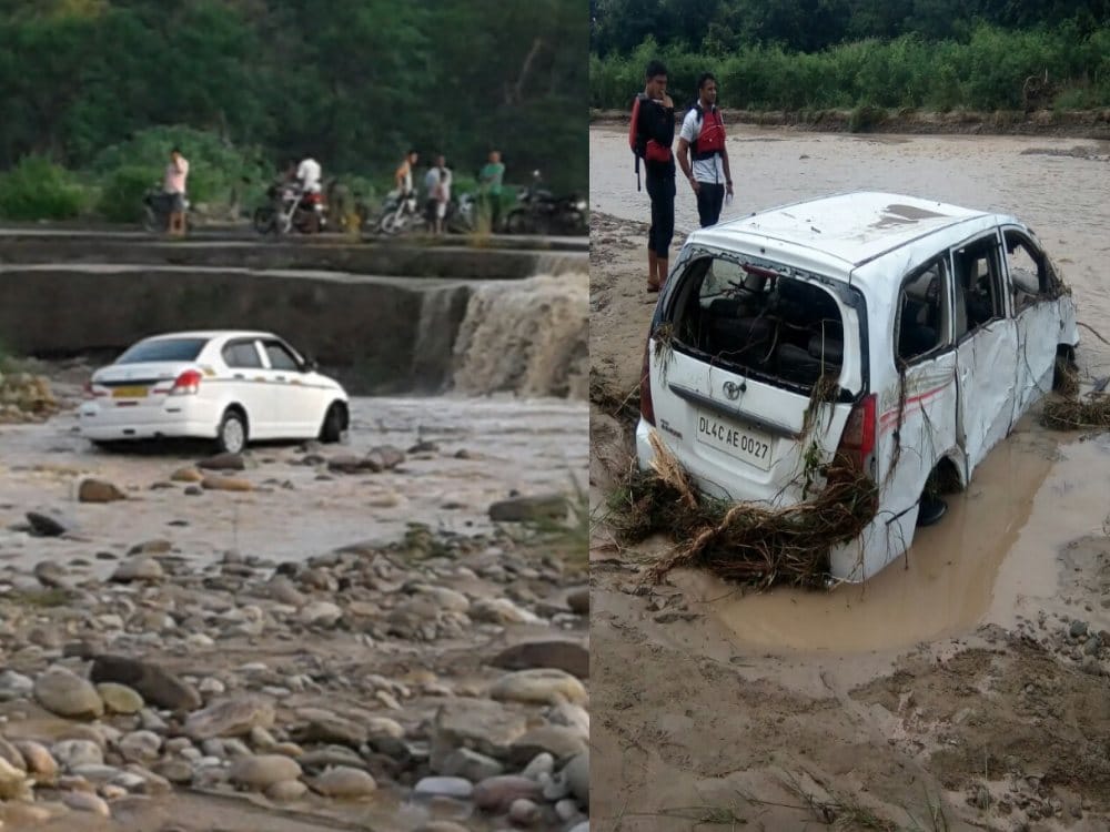after heavy rain vehicle flows in flood