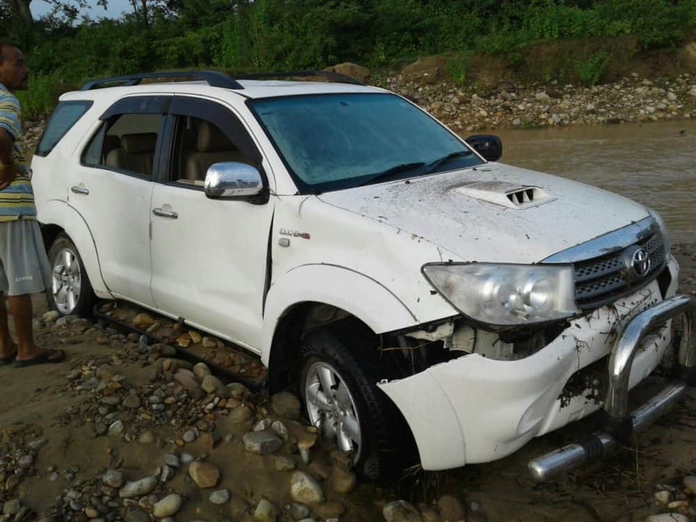 after heavy rain vehicle flows in flood