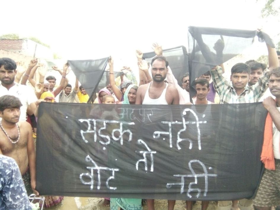 Villagers in Adupur black flag display