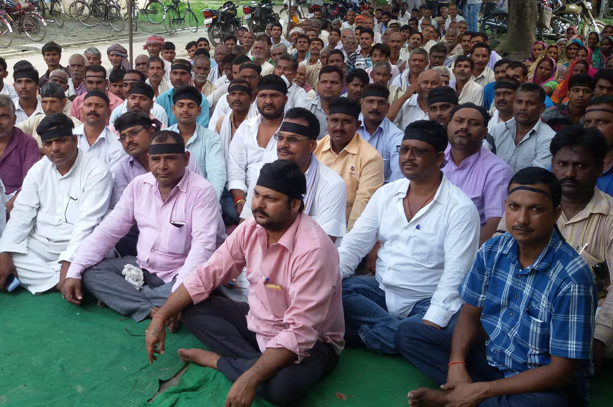 pradhan protested for action on ado panchayat