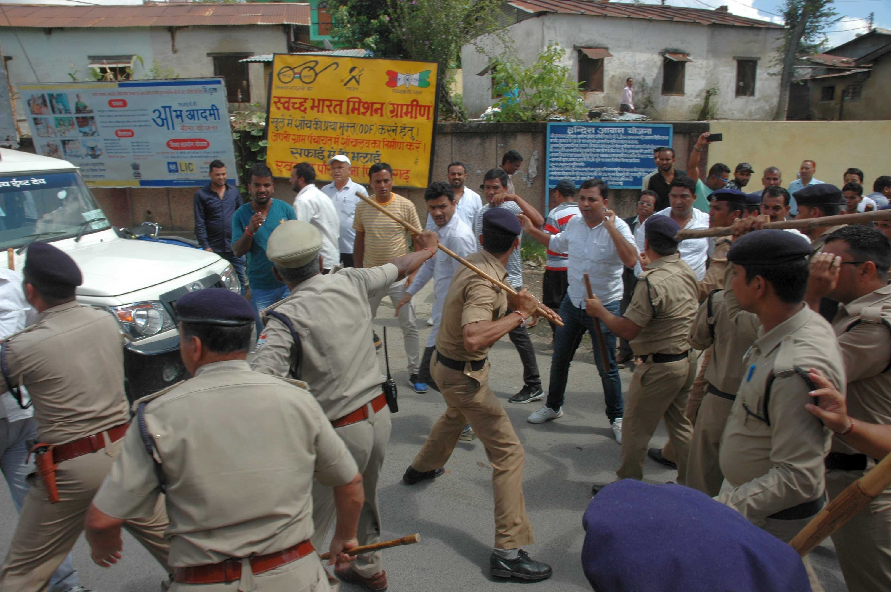 bjp worker protest cm, police lathi charge.