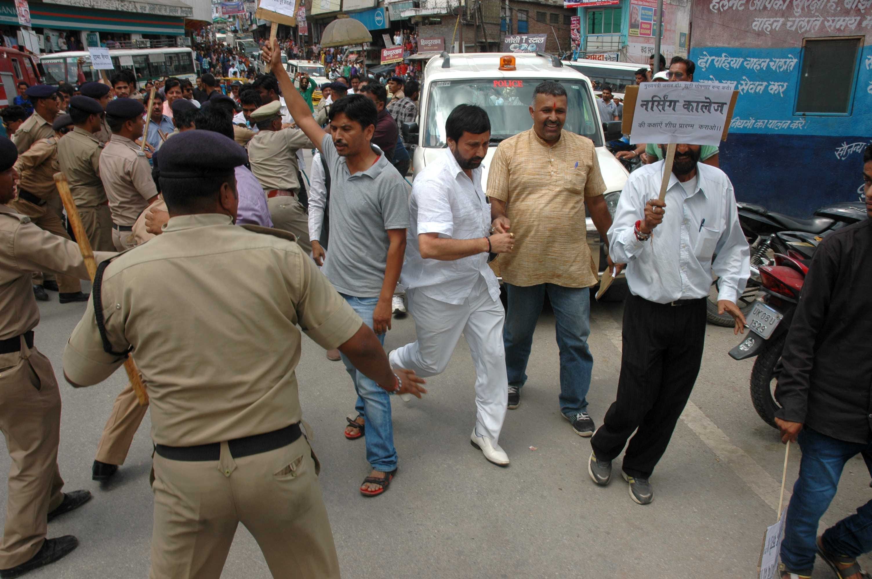bjp worker protest cm, police lathi charge.