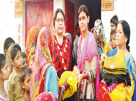 Sari distributed to flood victims