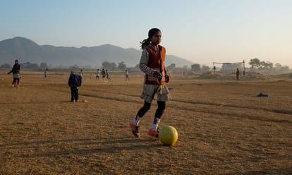 alakhpura village of bhiwani, where girls are football champions and practice with buffalows