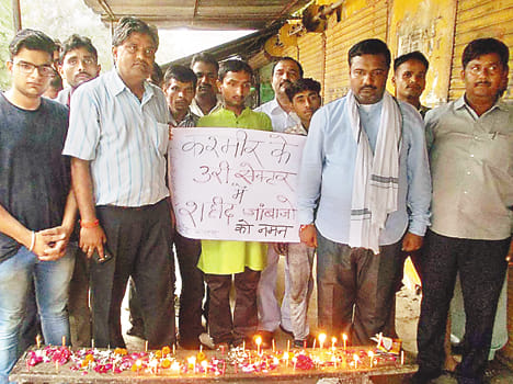 Candle lighting tribute to martyrs