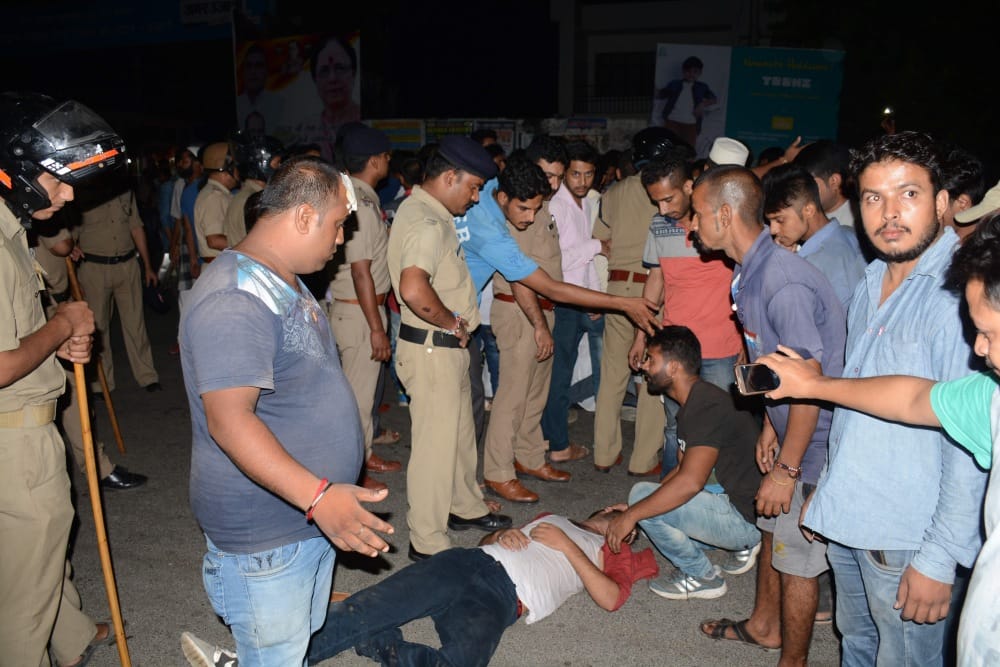 police beating innocent people, publice got angry