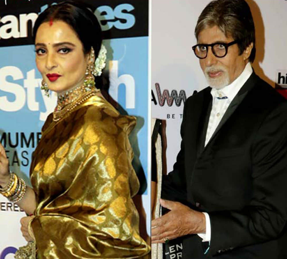 rekha spoted doing something inside her car