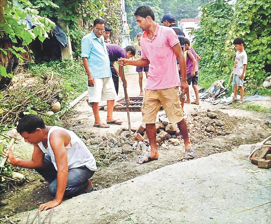 12 women and 6 men in labor for two days, making cast culvert and road damage