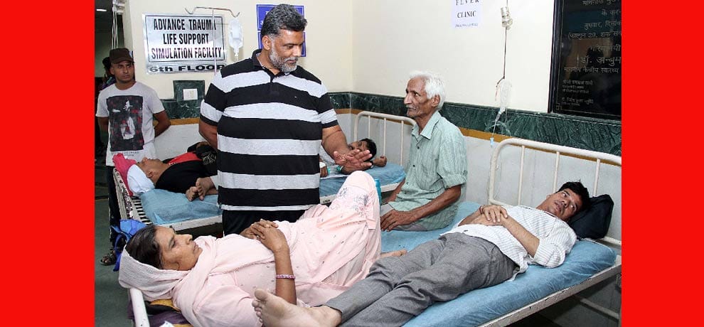 two patient on single bed .. one woman and another a man 