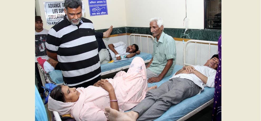 two patient on single bed .. one woman and another a man 