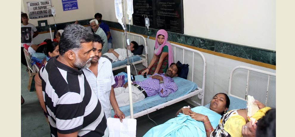 two patient on single bed .. one woman and another a man 