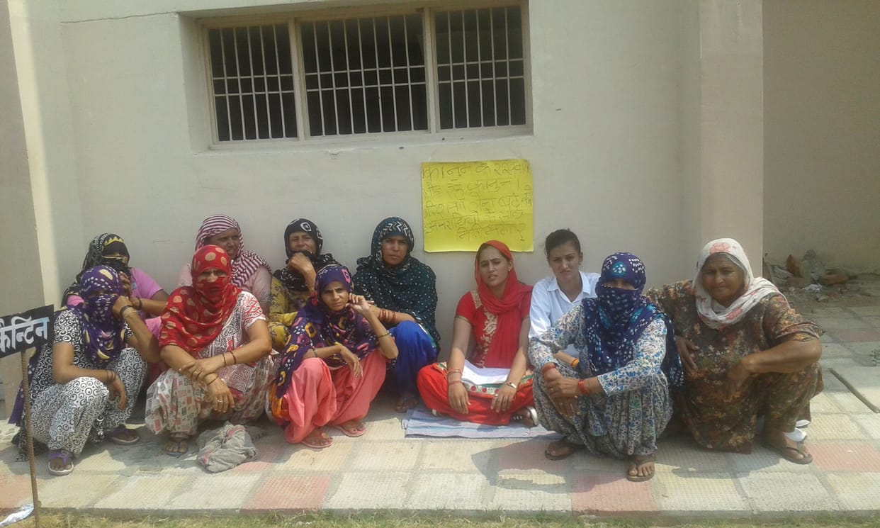 protest against husband, sister and wife sit on dsp ffice gate, haryana, rohtak