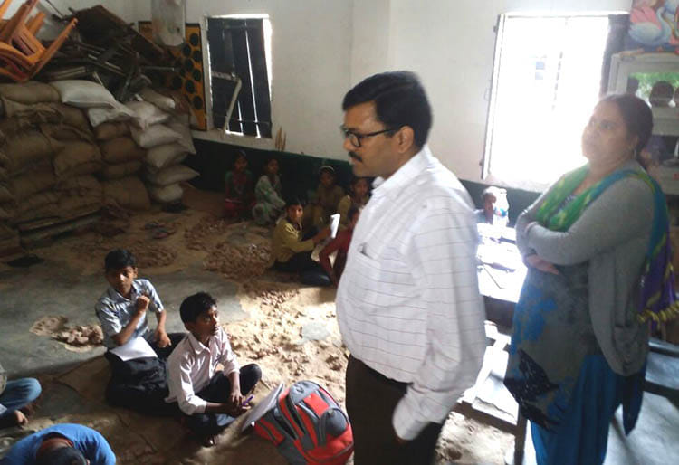 The school principal and teachers into a warehouse
