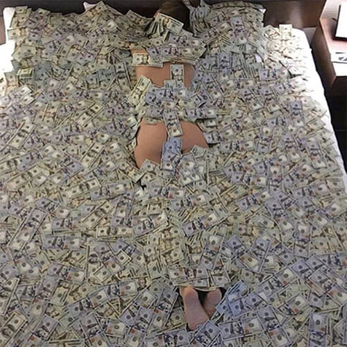 The Rich Kids lie on beds covered in money 
