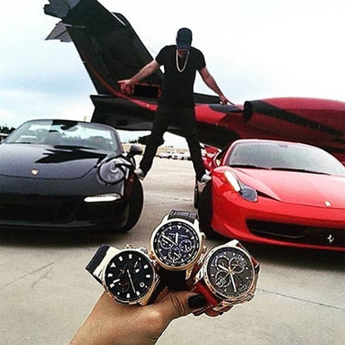 The Rich Kids lie on beds covered in money 