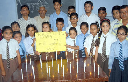 Candle lit somewhere, somewhere the silent tribute