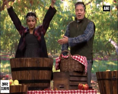 PeeCee again defeats Jimmy Fallon, this time at apple bobbing