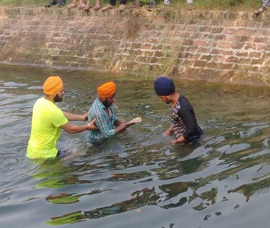 holy book guru granth sahib discourtesy in jalandhar, pages found in canal