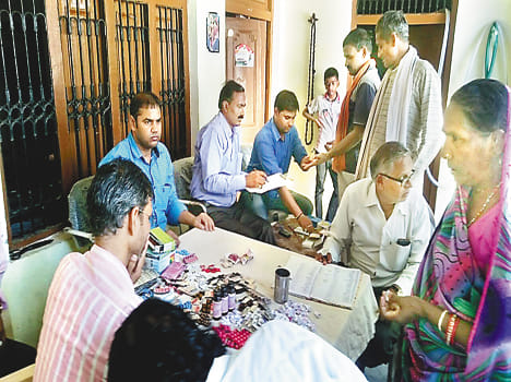 By teams of health department investigation