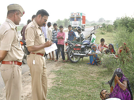 On the highway side of indebted farmer hanging swing