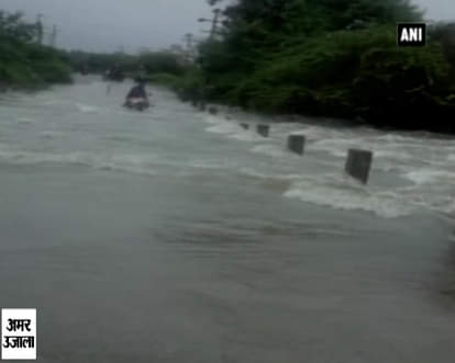 Watch: Flood water sweeps away biker 