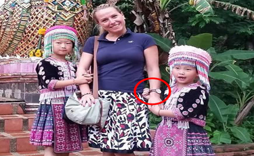 Two tiny Thai thieves steal from a female tourist