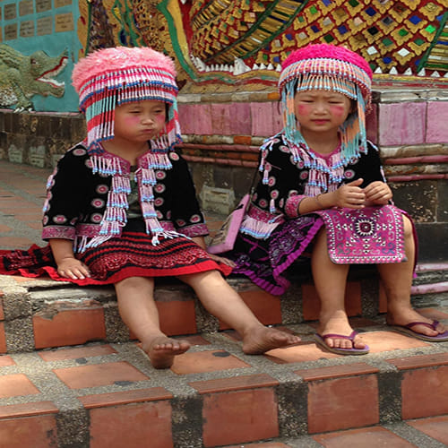 Two tiny Thai thieves steal from a female tourist