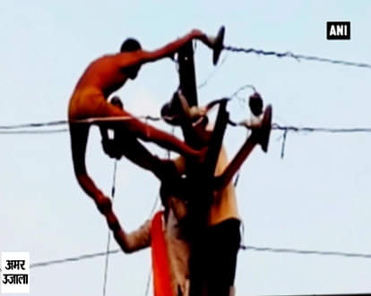 Watch: Drunk man climbs onto high voltage wires