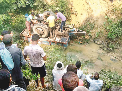 Tractor-trolley upturned, two killed