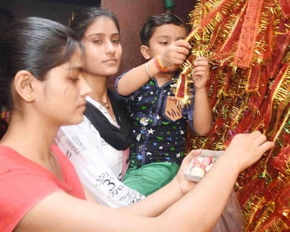  urn with installation devotees celebrate Mother Goddess