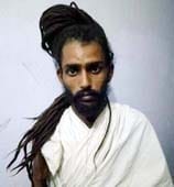 monk murderer killed bike mechanic, frantic firing, one injured