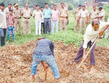 Police pulled the body from the grave