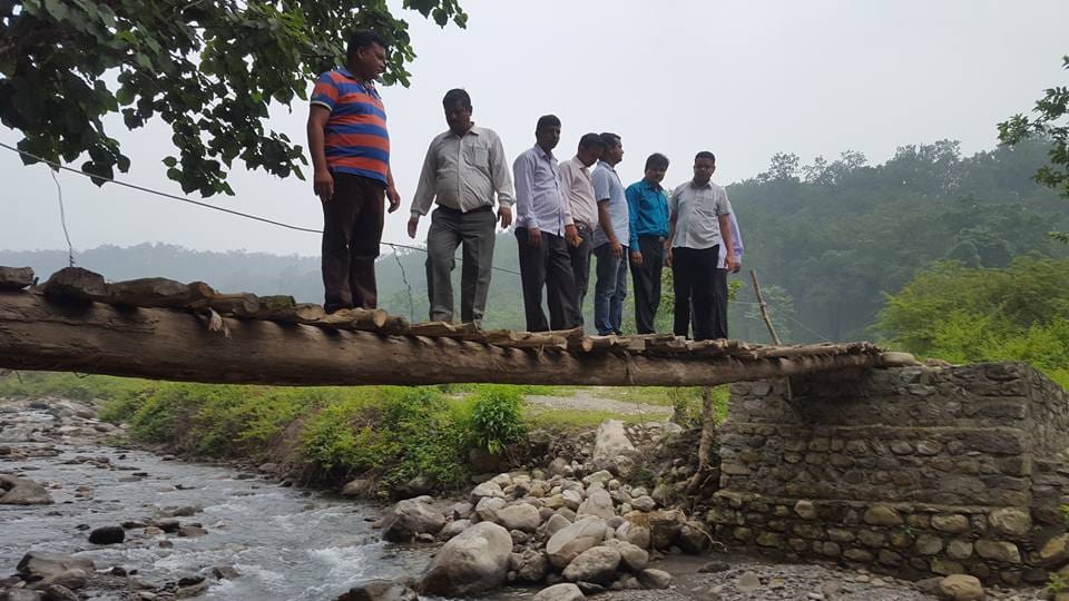 teacher make bridge on river for students