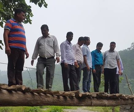 teacher make bridge on river for students