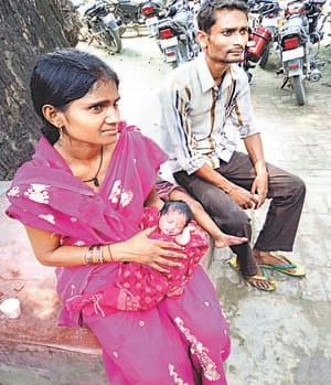 girl child thrown away on road side