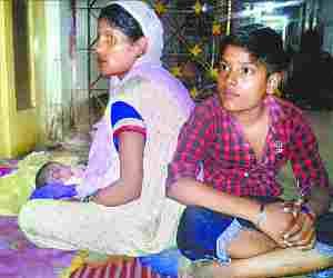 Mother and baby are lying on the floor