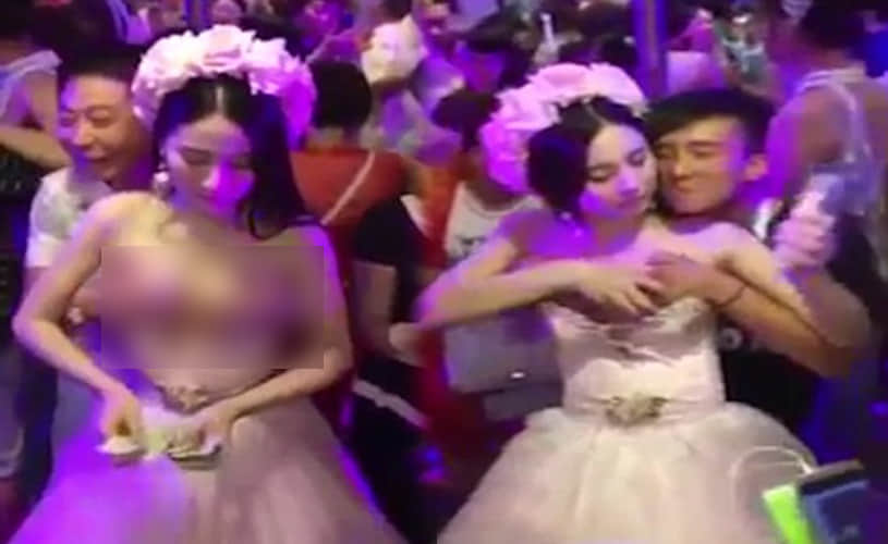Chinese bride allows guests to molest her during the ceremony