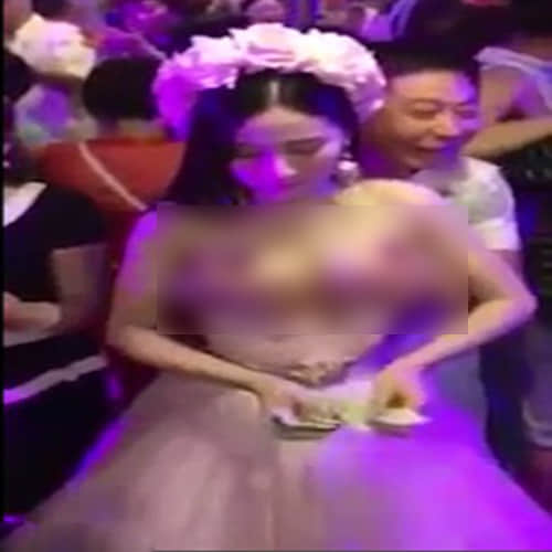 Chinese bride allows guests to molest her during the ceremony