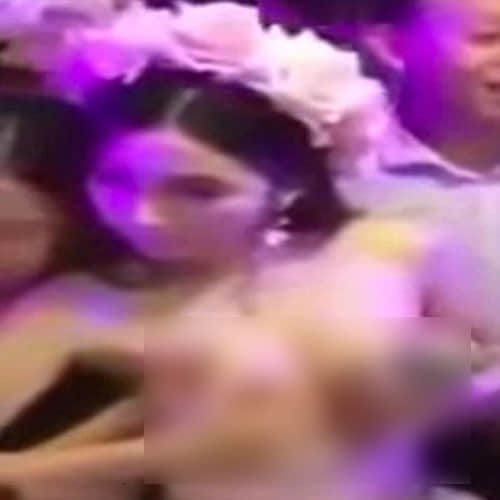 Chinese bride allows guests to molest her during the ceremony